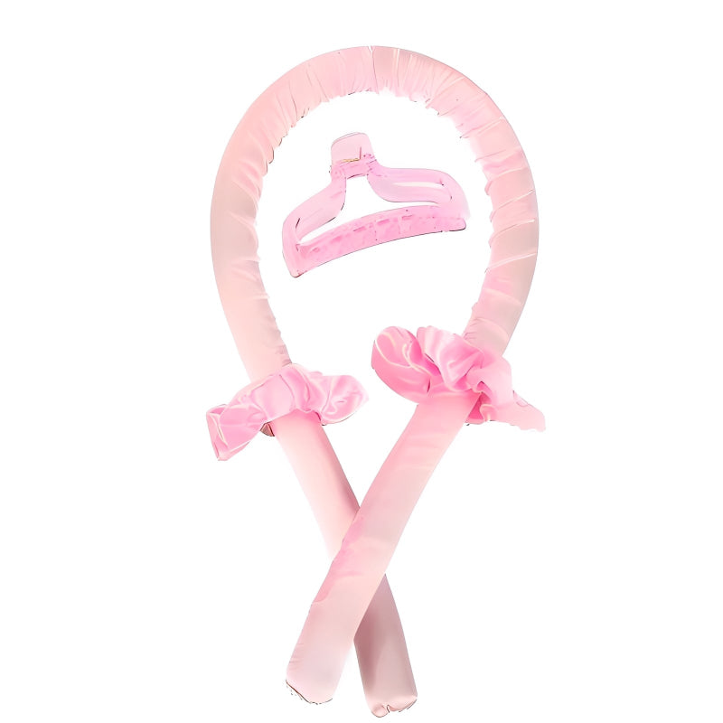 Pink headband with hair attachments on a white background