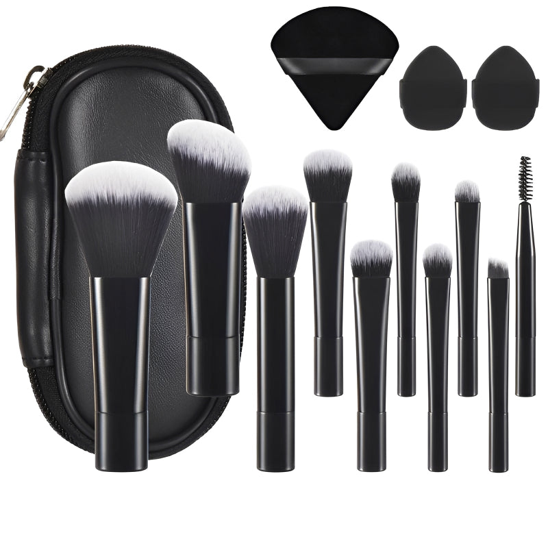 Makeup brush set with black case and various brushes on a white background