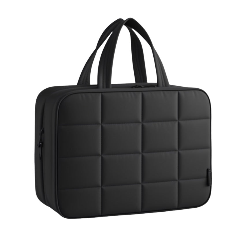 Black quilted briefcase on a white background