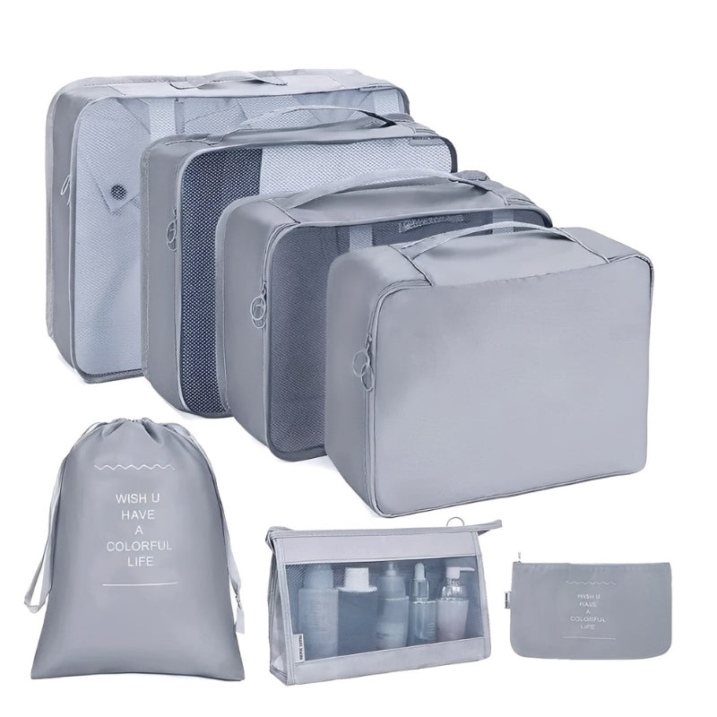 Set of gray packing cubes and travel bags on a white background