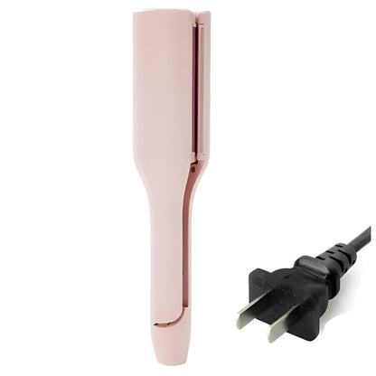 Pink hair curler with power cord on a white background
