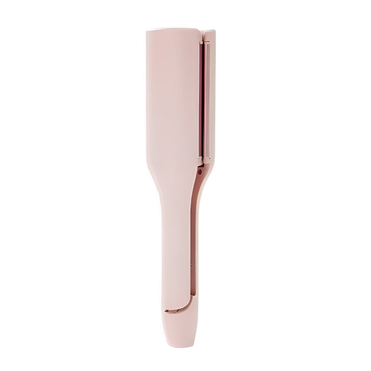 Rose gold hair curler on a white background