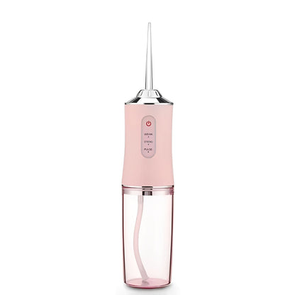 Pink dental water flosser on a white background