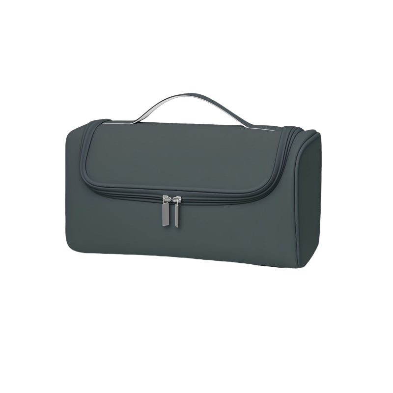 Dark green toiletry bag with silver zippers on a white background