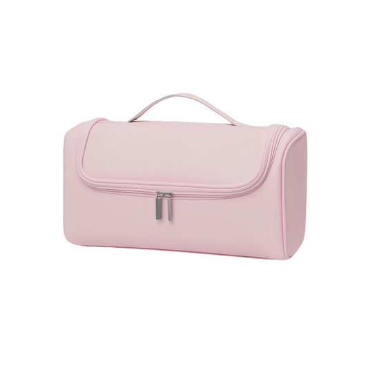 Pink toiletry bag with a handle on a white background