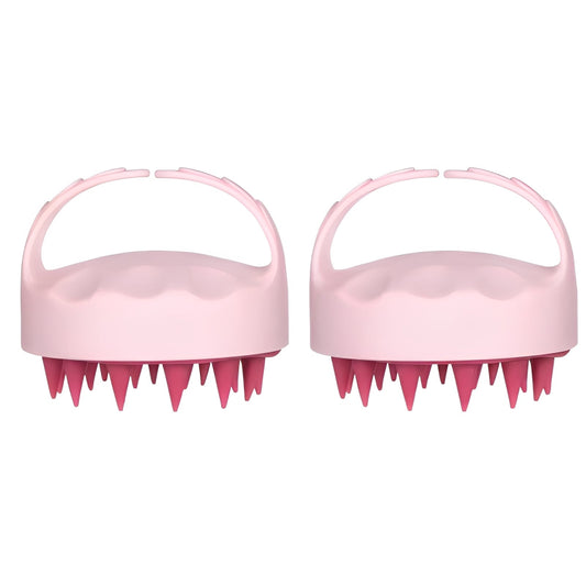 Two pink scalp massagers with textured design on a white background