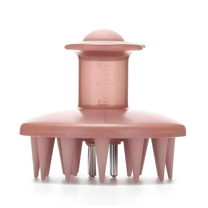 Pink scalp massager with measurement markings on a white background