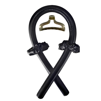 Black headband with hair accessories on a white background