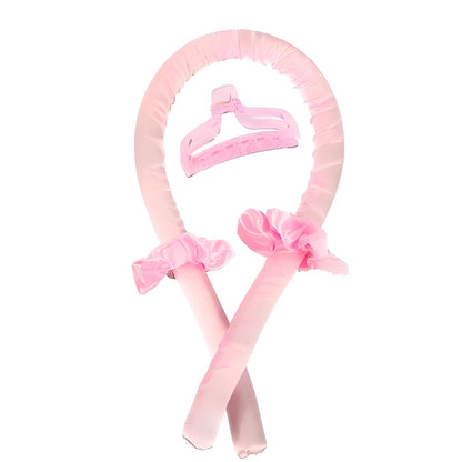 Pink headband with hair attachments on a white background