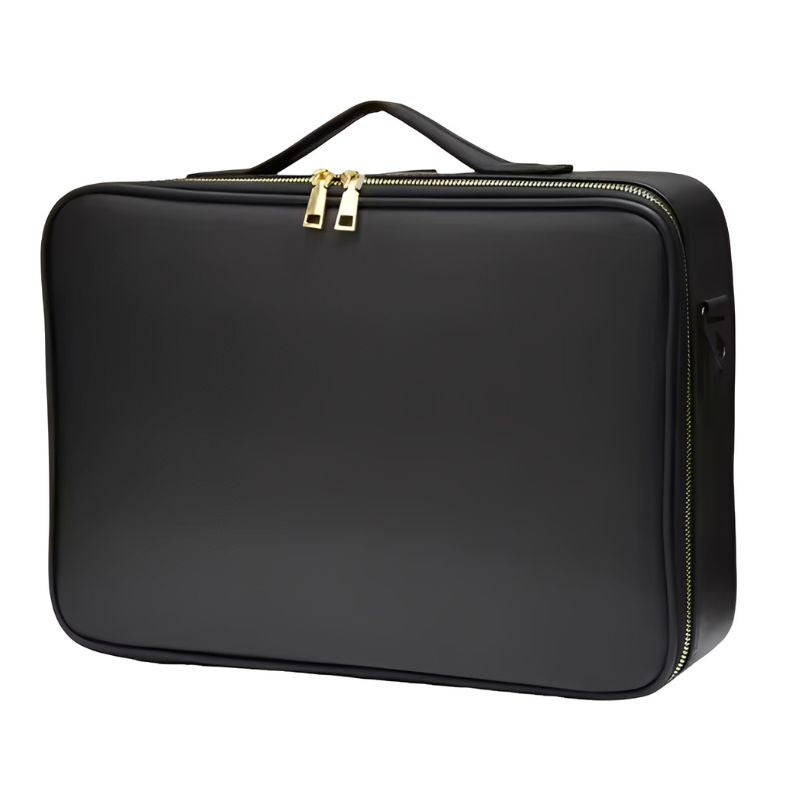 Black makeup case with gold zipper on a white background