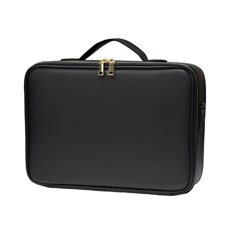 Black makeup case with gold zippers on a white background