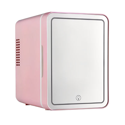 Pink and white mini refrigerator on a white background