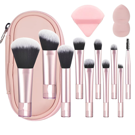 Makeup brush set with pink case and accessories on a white background