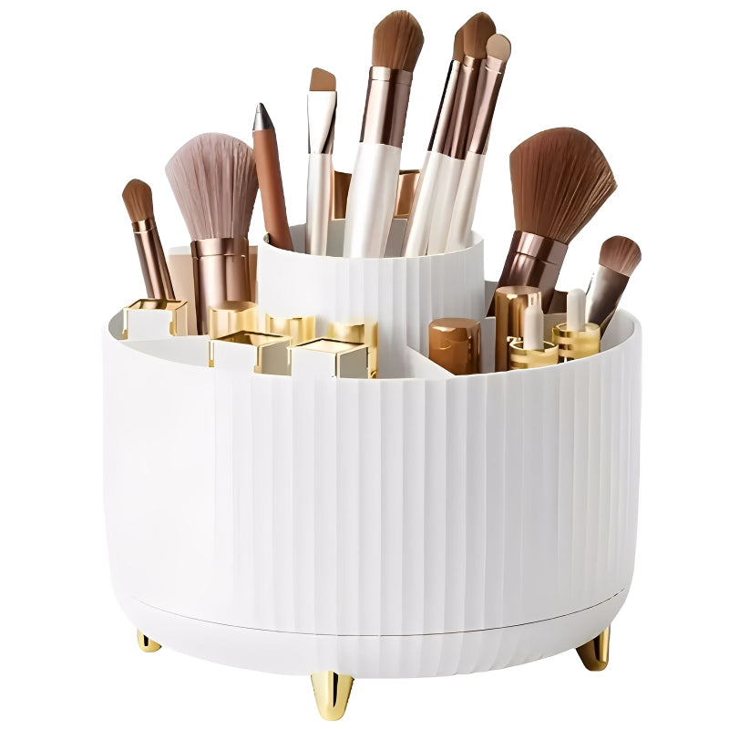 White and gold makeup brush holder with various brushes on a white background