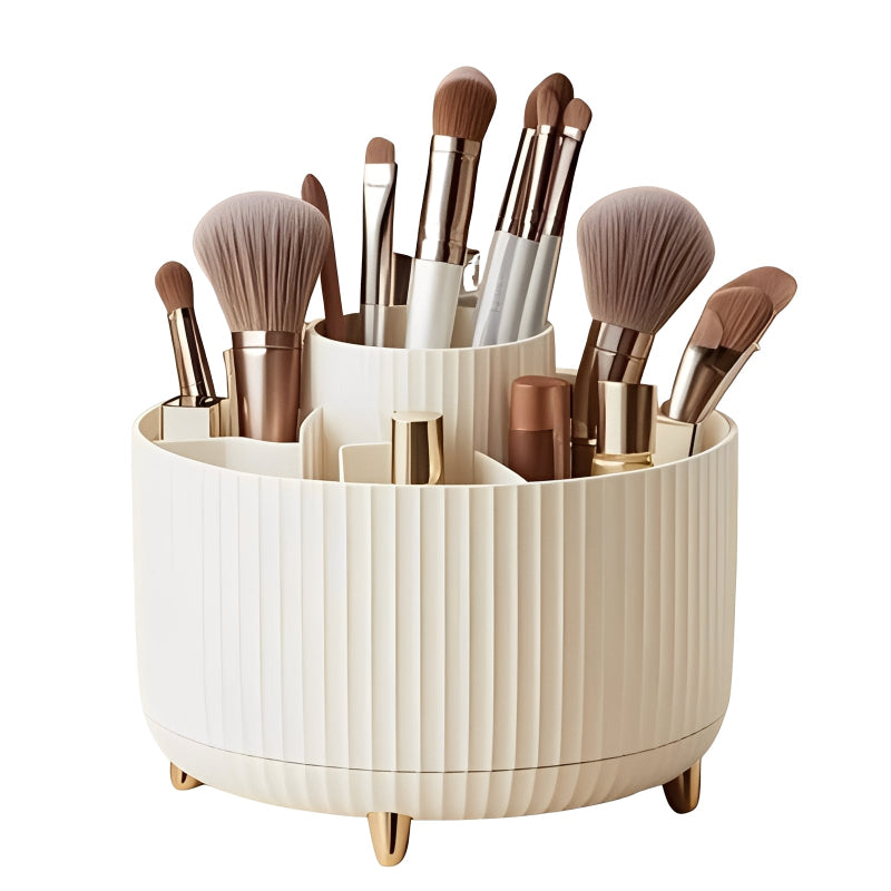 Makeup brush set in a white cylindrical holder on a white background